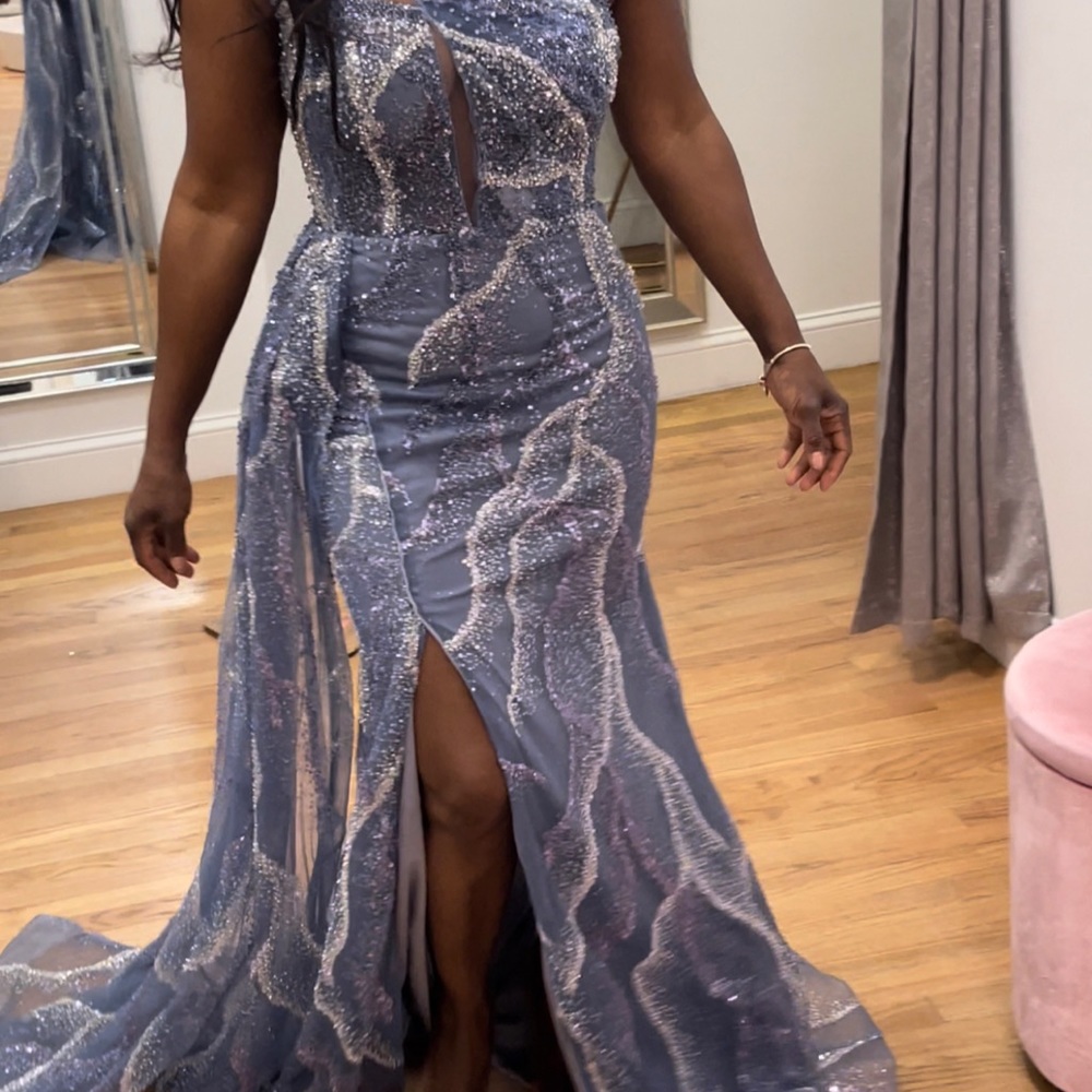 This is a beautiful one-shoulder sleeve beaded dress that fits beautifully.